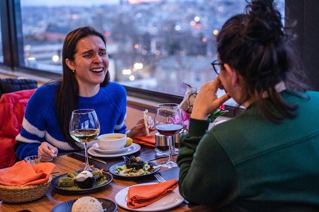 friends laughing at dinner